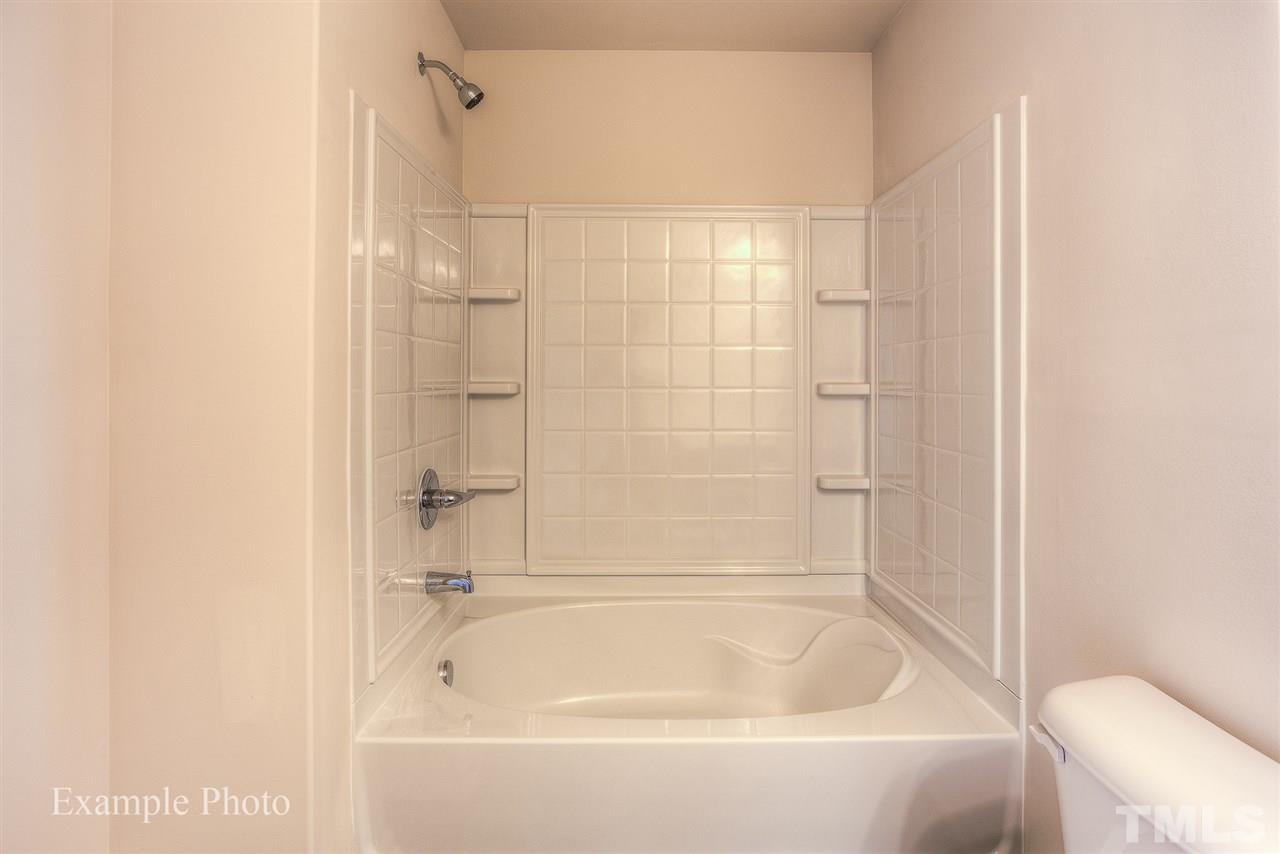 9673 Jernigan Road Spring Hope, NC 27882 - Photo 22 of 24 a bathroom with a bathtub and a shower