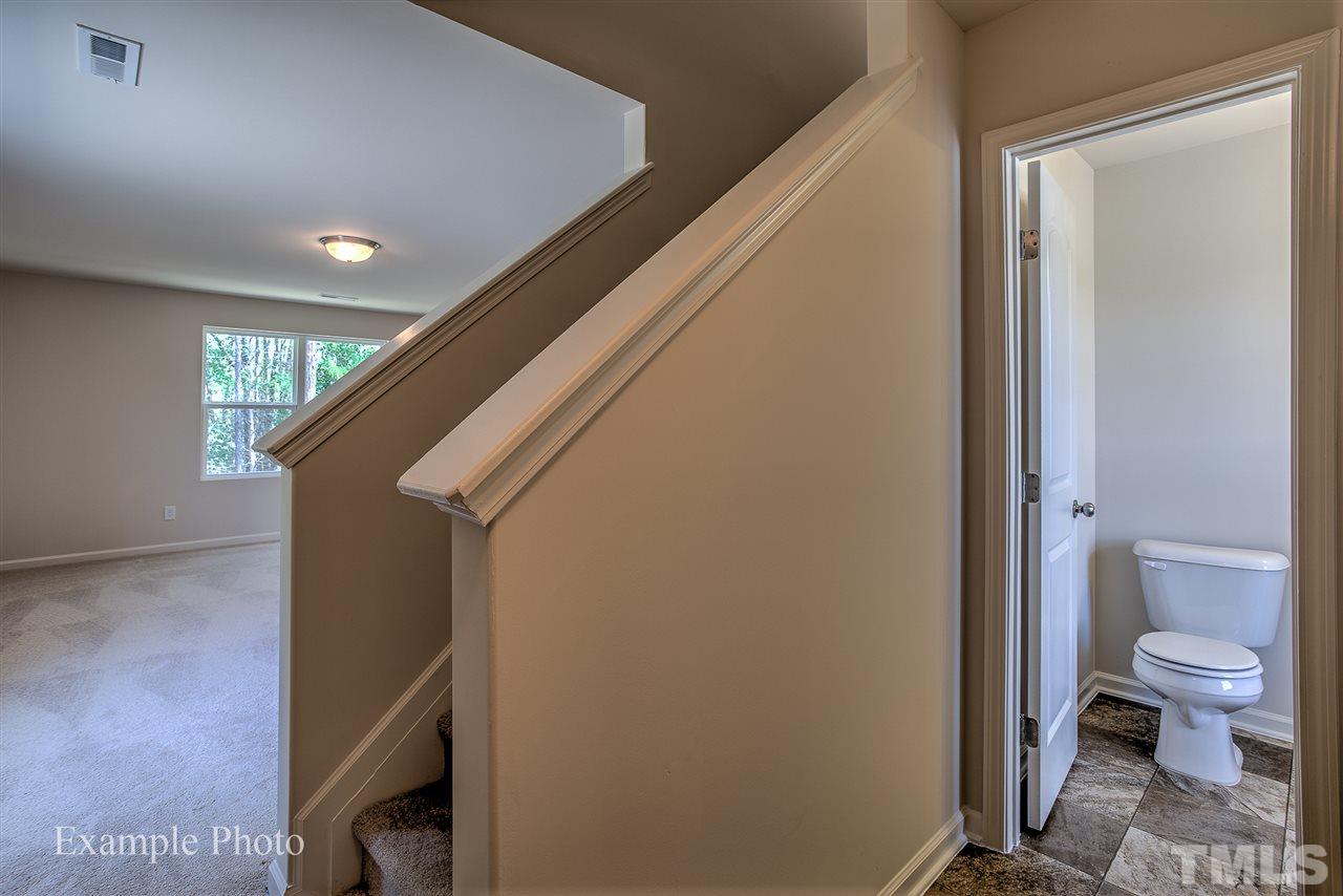 9673 Jernigan Road Spring Hope, NC 27882 - Photo 4 of 24 a view of a hallway with toilet and a shower