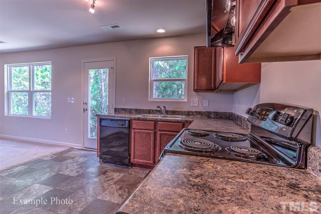 9673 Jernigan Road Spring Hope, NC 27882 - Photo 10 of 24 a kitchen with stove a sink and a refrigerator