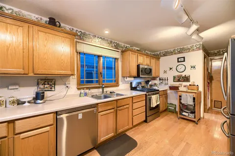 a kitchen with sink cabinets and window