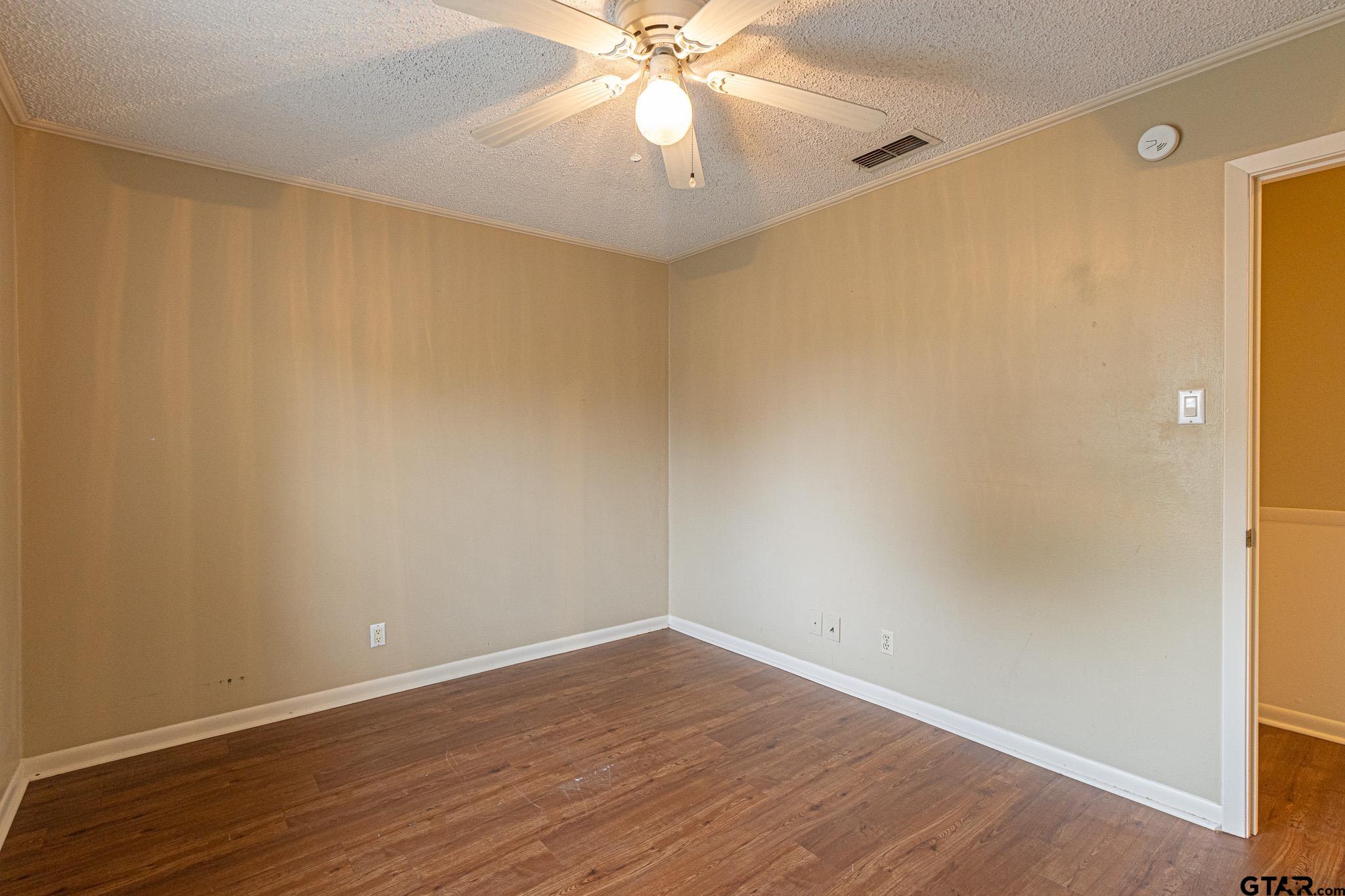 1202 Ridgeview Drive Tyler, TX 75701 - Photo 12 of 20 wooden floor in an empty room