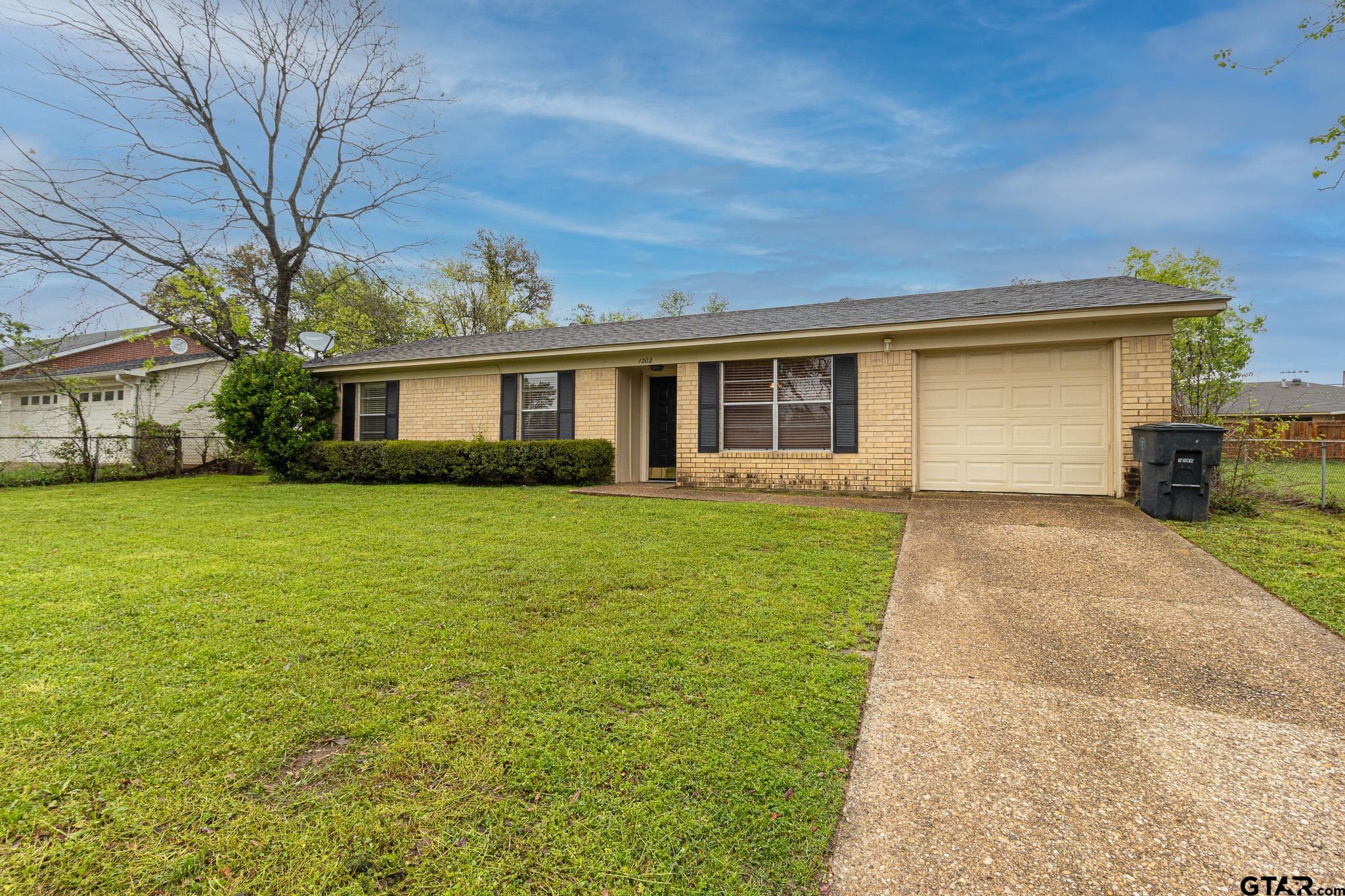 1202 Ridgeview Drive Tyler, TX 75701 - Photo 2 of 20 a front view of house with yard and green space