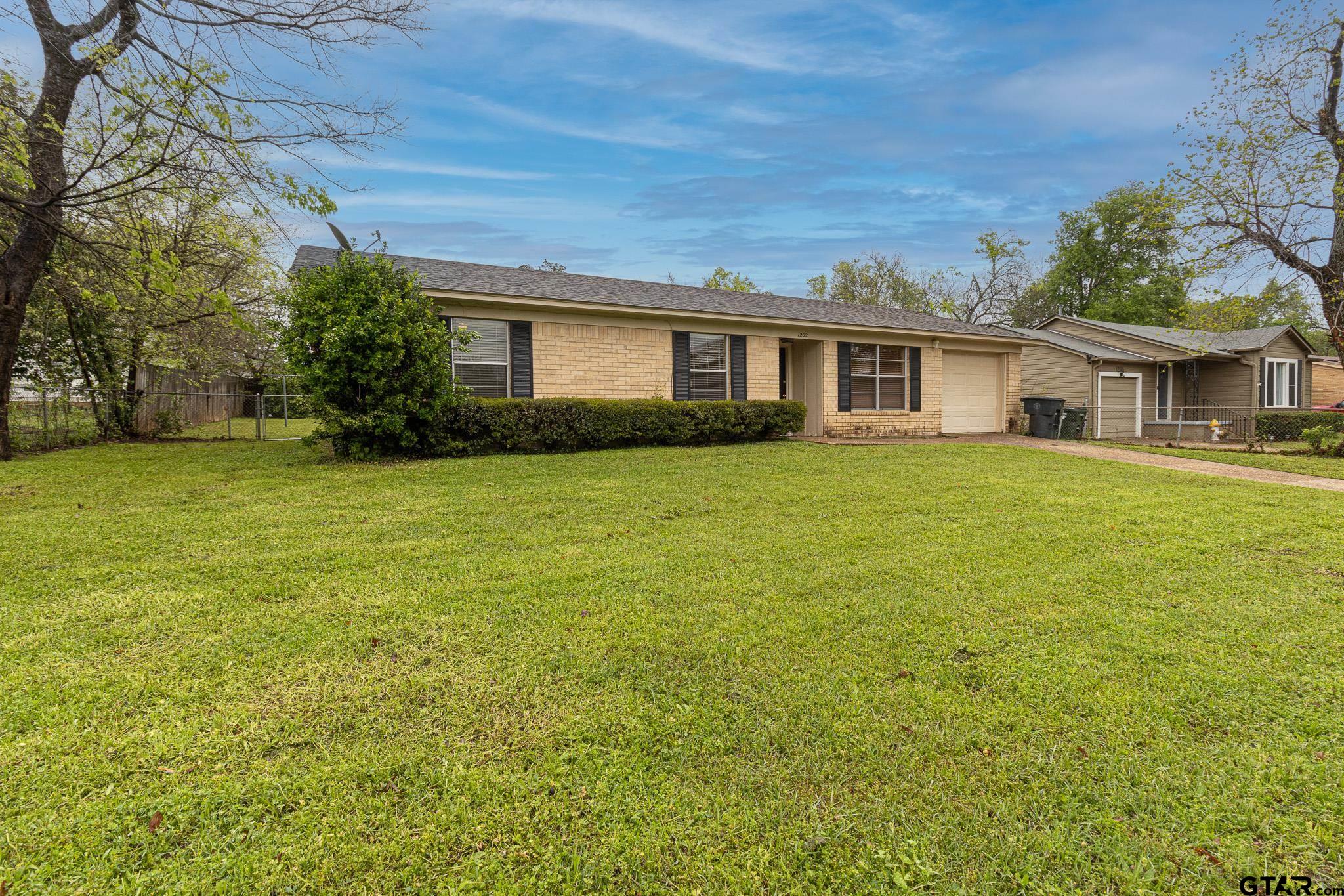 1202 Ridgeview Drive Tyler, TX 75701 - Photo 3 of 20 a front view of house with yard and trees