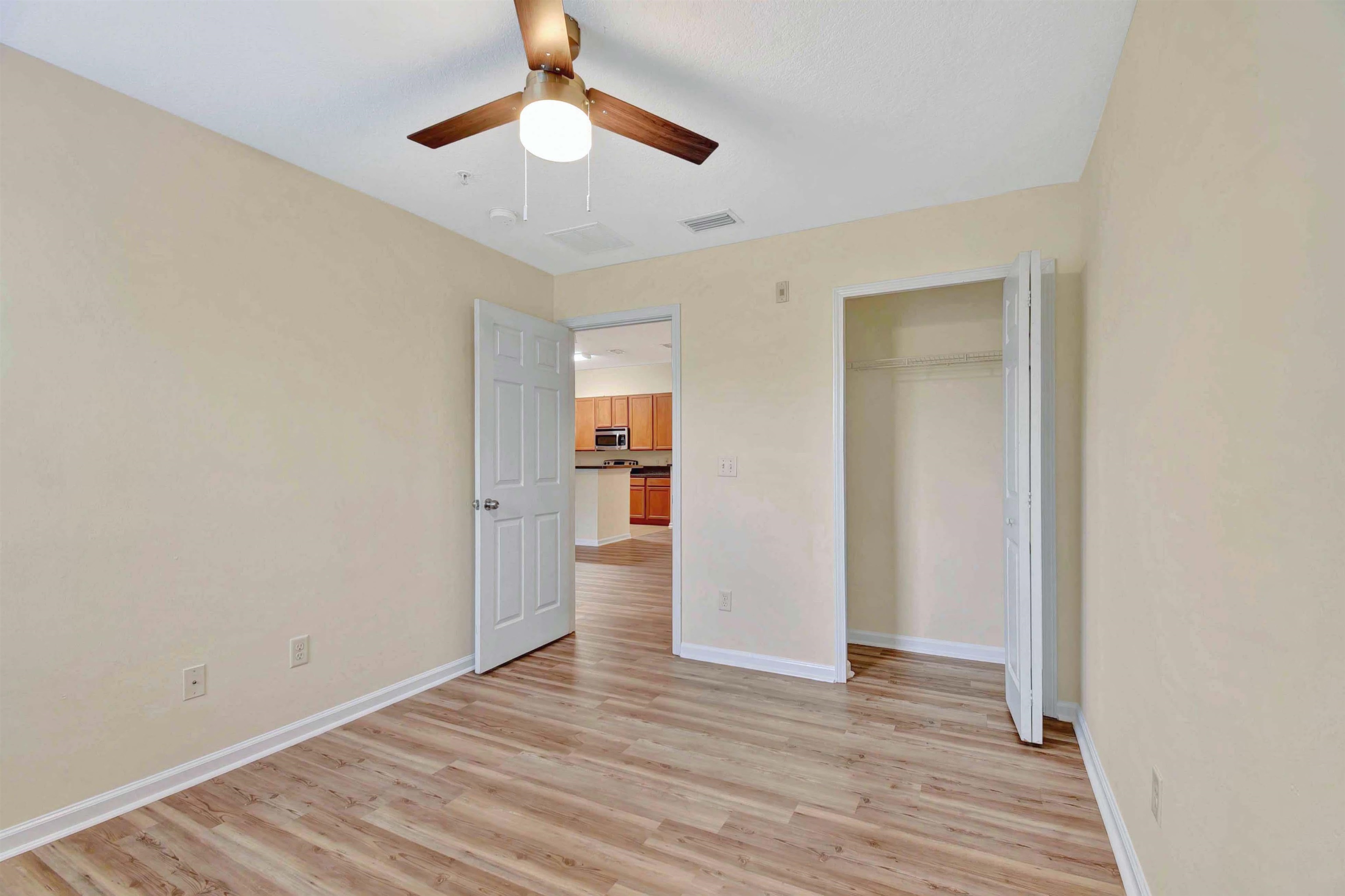 617 Golden Lake Loop St. Augustine, FL 32084 - Photo 12 of 25 a view of empty room with wooden floor