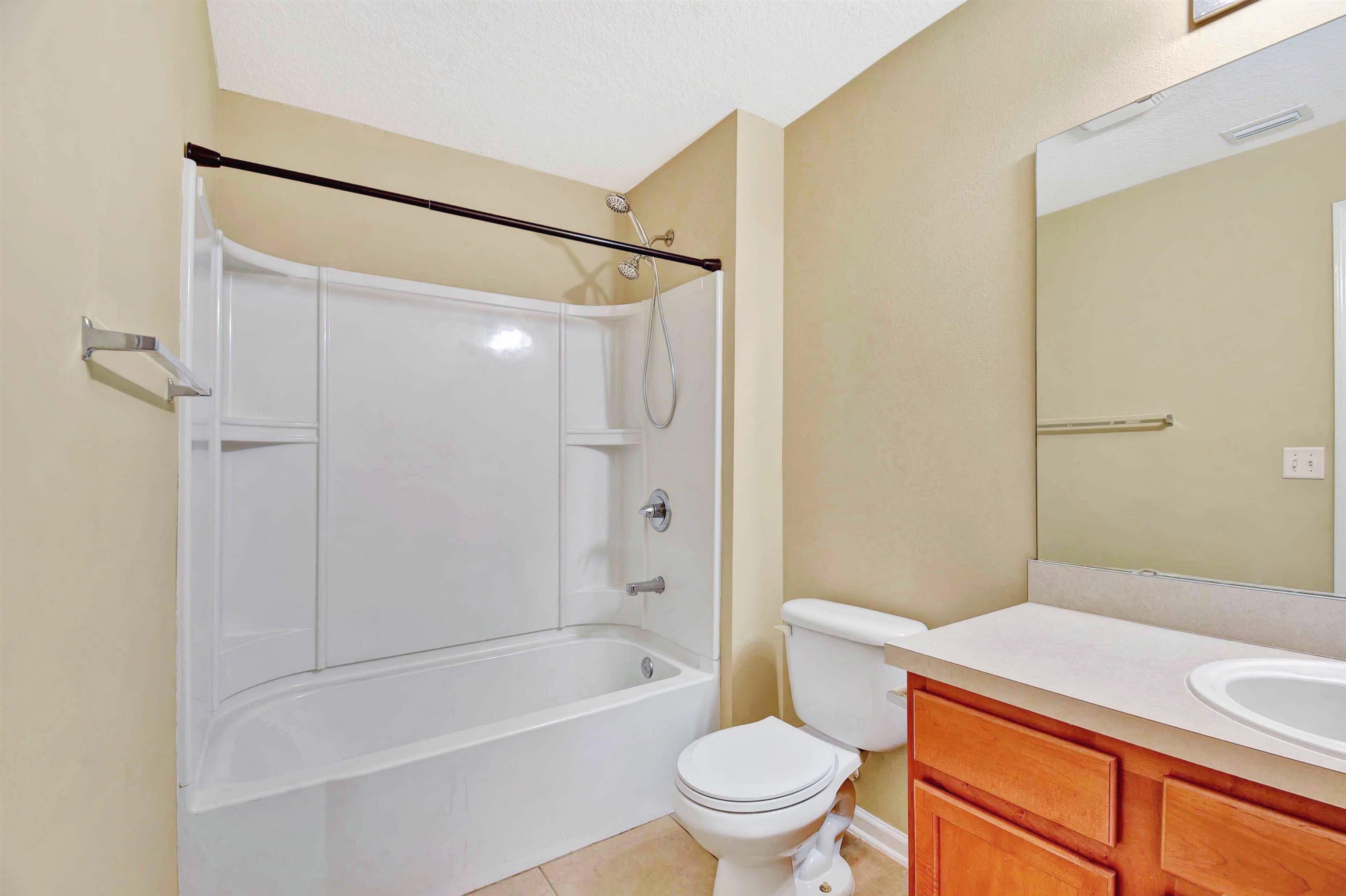 617 Golden Lake Loop St. Augustine, FL 32084 - Photo 13 of 25 a bathroom with a sink a toilet and shower