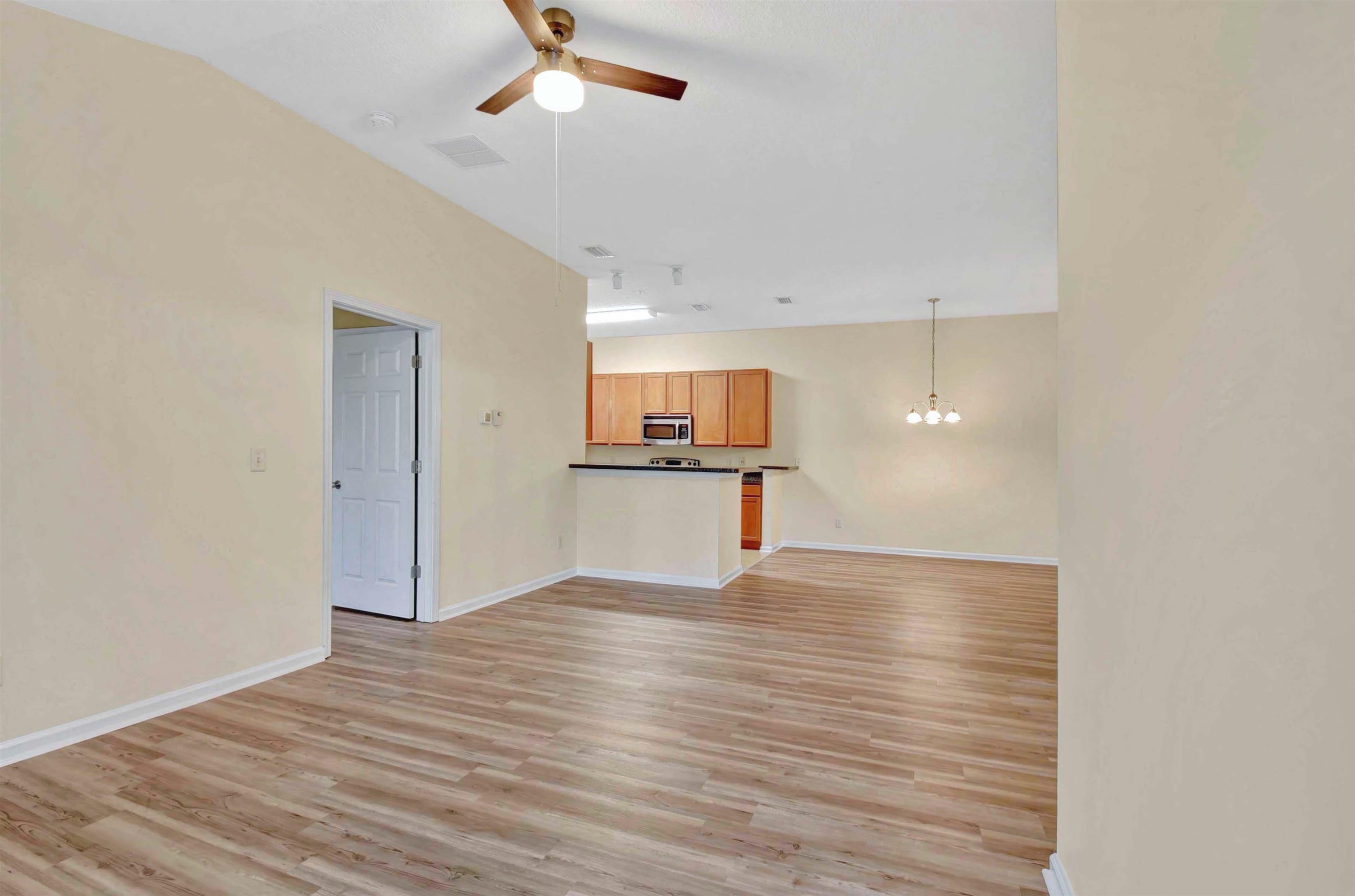 617 Golden Lake Loop St. Augustine, FL 32084 - Photo 20 of 25 a view of a kitchen with a sink and wooden floor