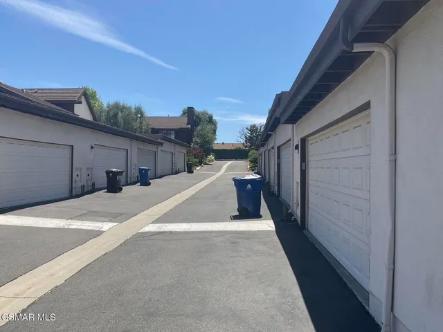 a view of a chairs and table in the patio with a fire pit