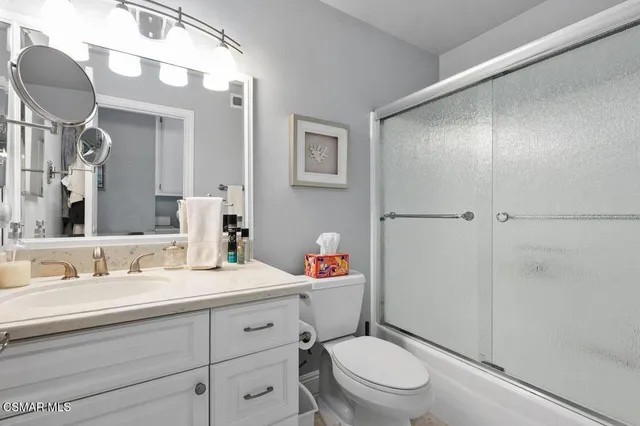 a bedroom with bed and a couch