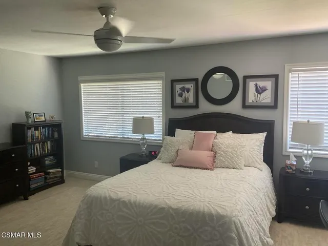 a bedroom with a bed and a closet