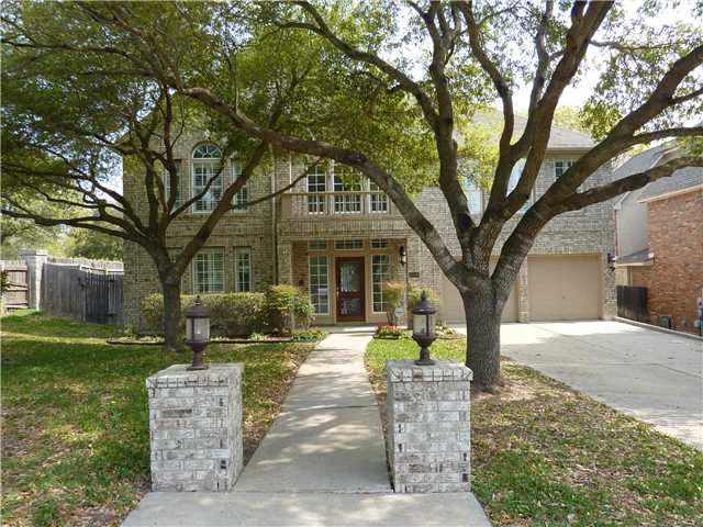 10846 Redmond Road Austin, TX 78739 - Photo 1 of 1 a front view of a house with a yard