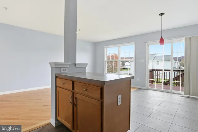 a kitchen with stainless steel appliances granite countertop a sink and a window
