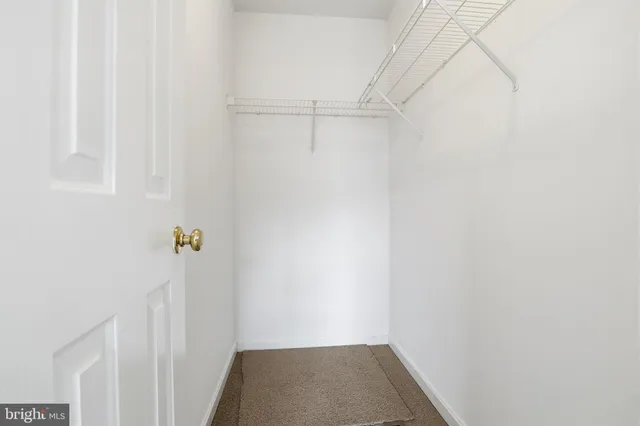 a bathroom with a granite countertop toilet a sink and a bathtub