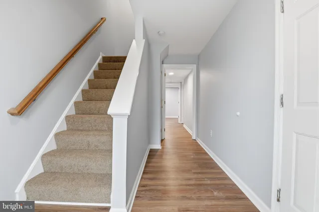 a view of staircase with white walls