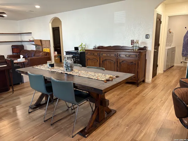 a view of a dining room with furniture and wooden floor