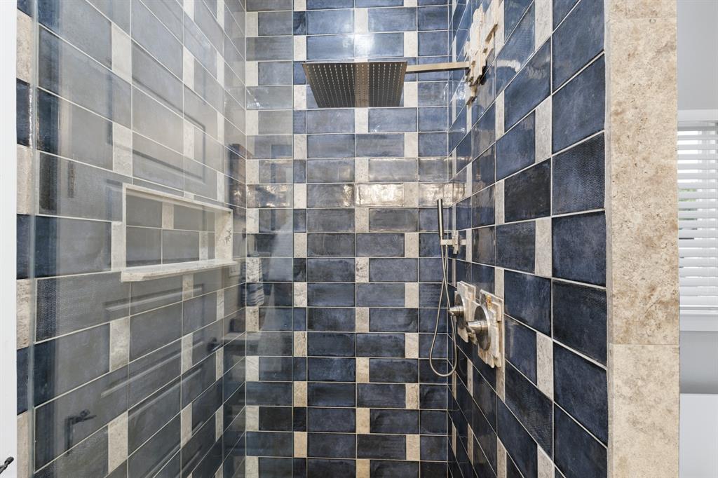 2972 North Trinity Street Decatur, TX 76234 - Photo 20 of 36 Vibrant blue tilework in shower with oversized shower head, perfect for relaxing.
