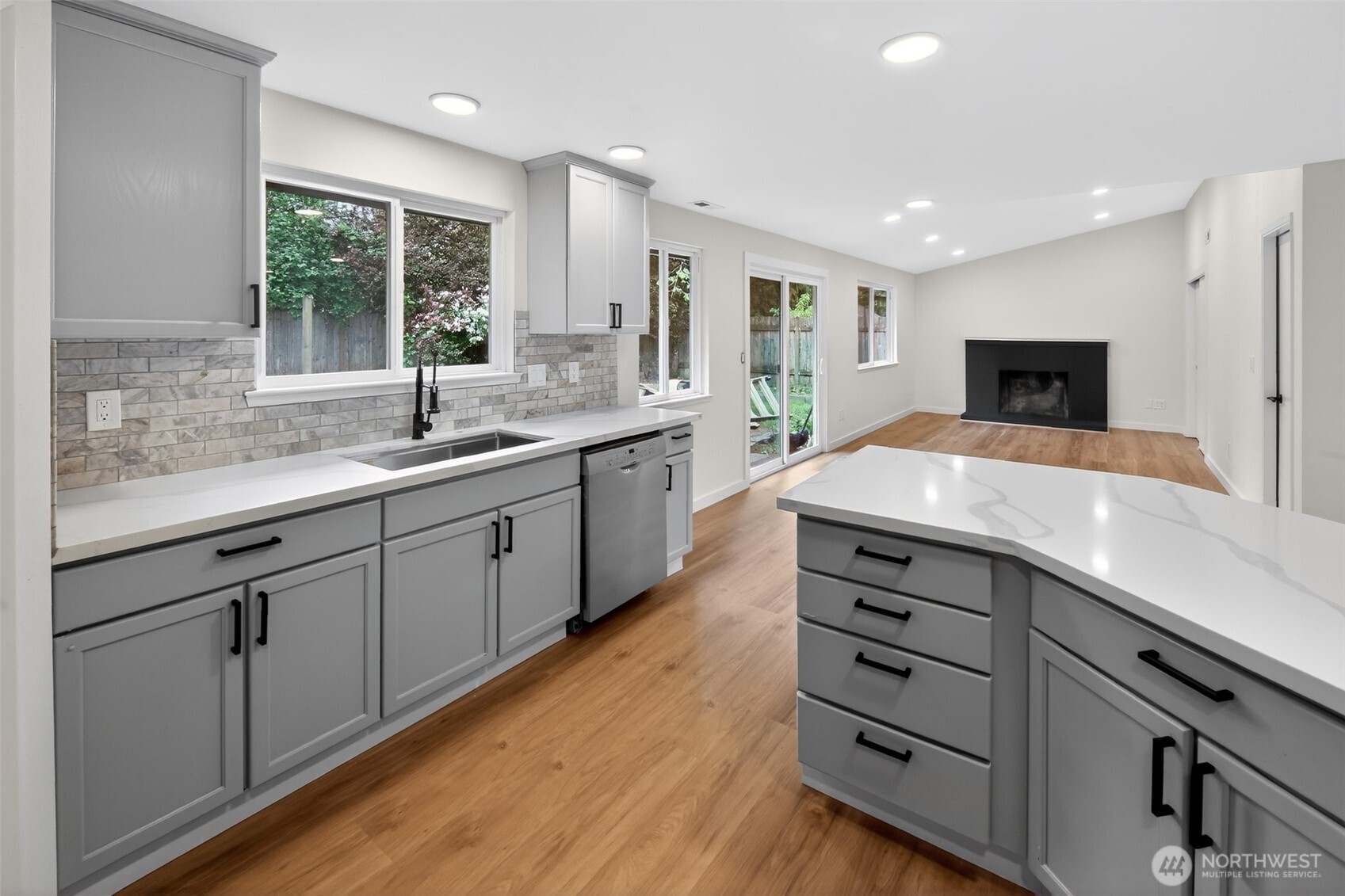 320 213th Place Southwest Bothell, WA 98021 - Photo 3 of 29 a kitchen with a sink and cabinets