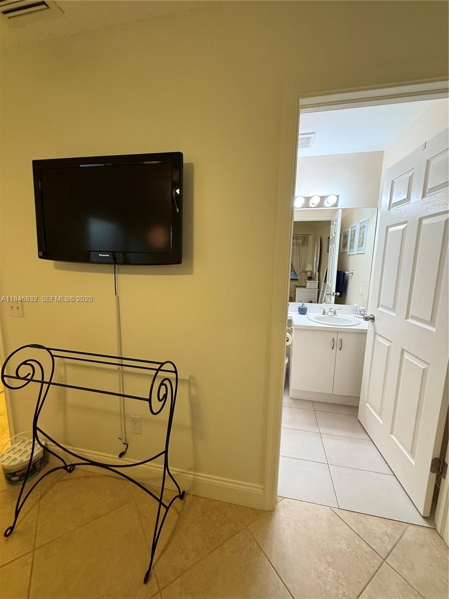 417 Waterside Drive Hypoluxo, FL 33462 - Photo 20 of 52 a view of a bathroom with a sink dryer and washer