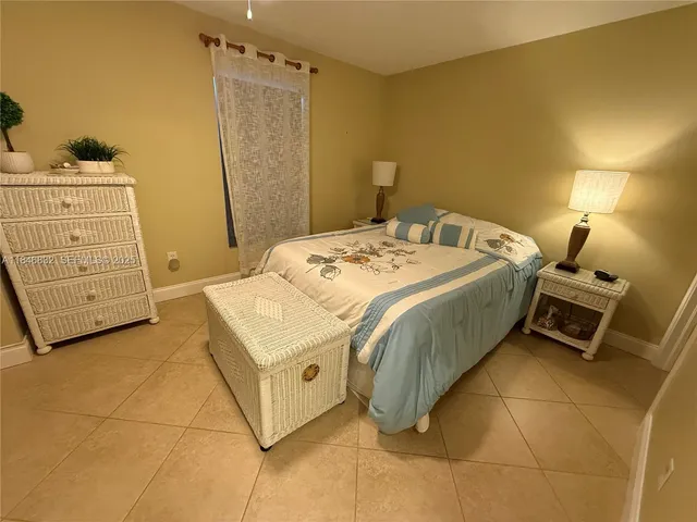 a bedroom with a bed and a table