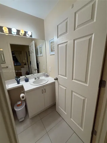 a view of a porch with chairs and backyard