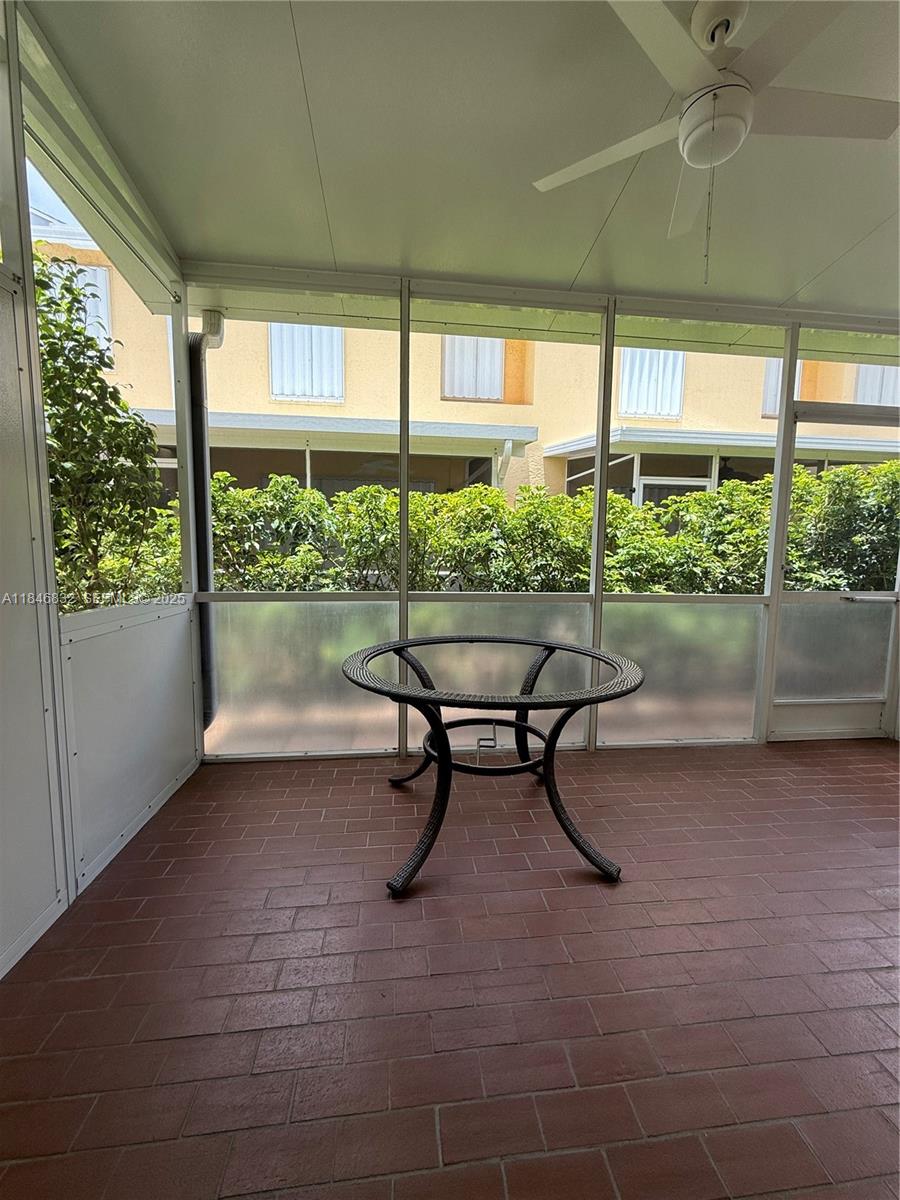 417 Waterside Drive Hypoluxo, FL 33462 - Photo 33 of 52 a view of a porch with chairs and backyard