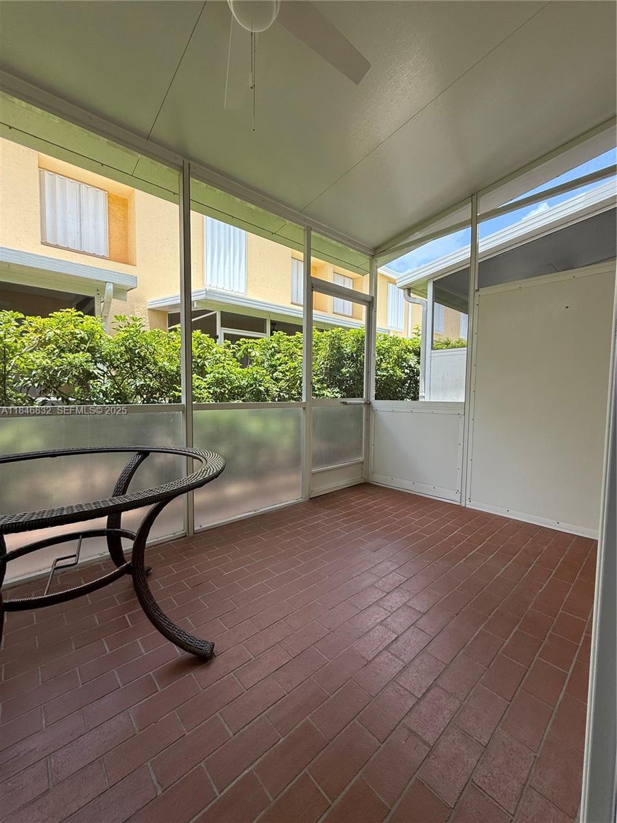 417 Waterside Drive Hypoluxo, FL 33462 - Photo 34 of 52 a view of a room with porch and furniture