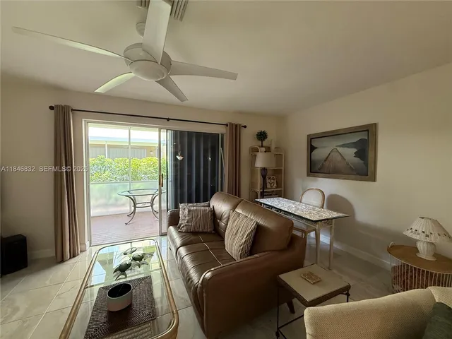 a room with furniture and a flat screen tv