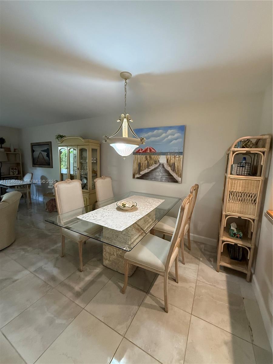 417 Waterside Drive Hypoluxo, FL 33462 - Photo 41 of 52 a view of a dining room with furniture