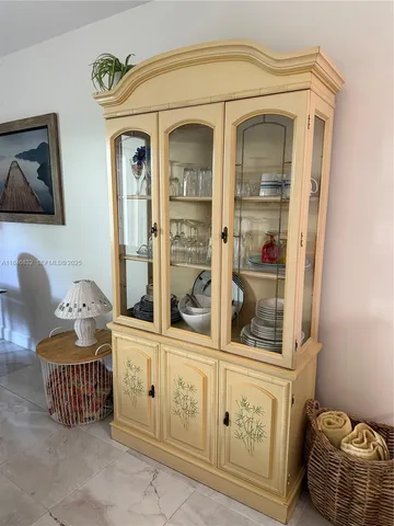a view of a dining room with furniture and a window