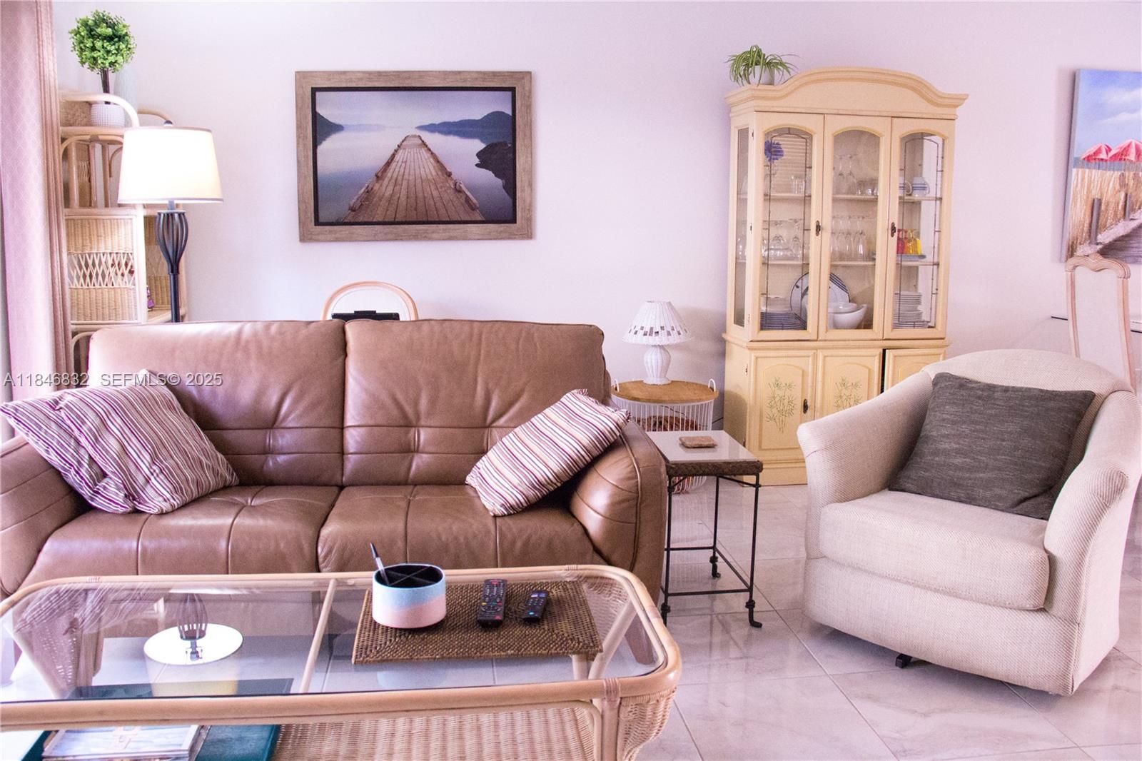 417 Waterside Drive Hypoluxo, FL 33462 - Photo 46 of 52 a living room with furniture and a window