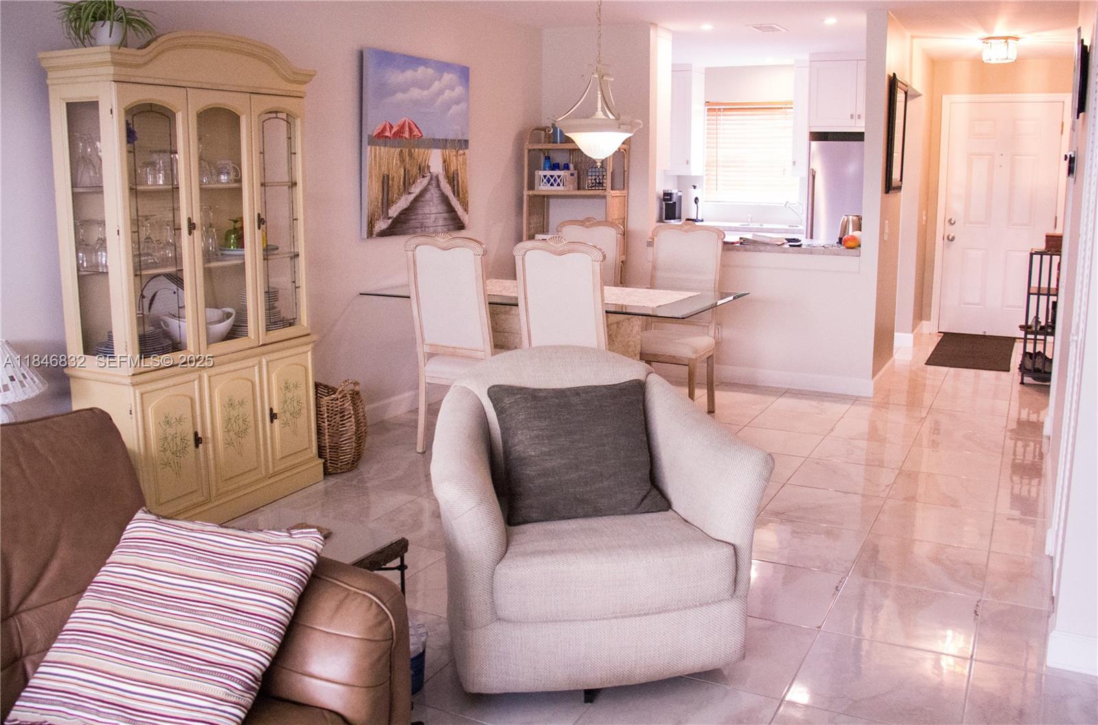 417 Waterside Drive Hypoluxo, FL 33462 - Photo 47 of 52 a living room with furniture and a large window