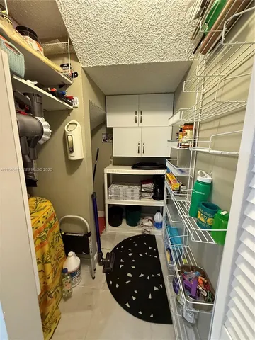 a view of swimming pool with lounge chair