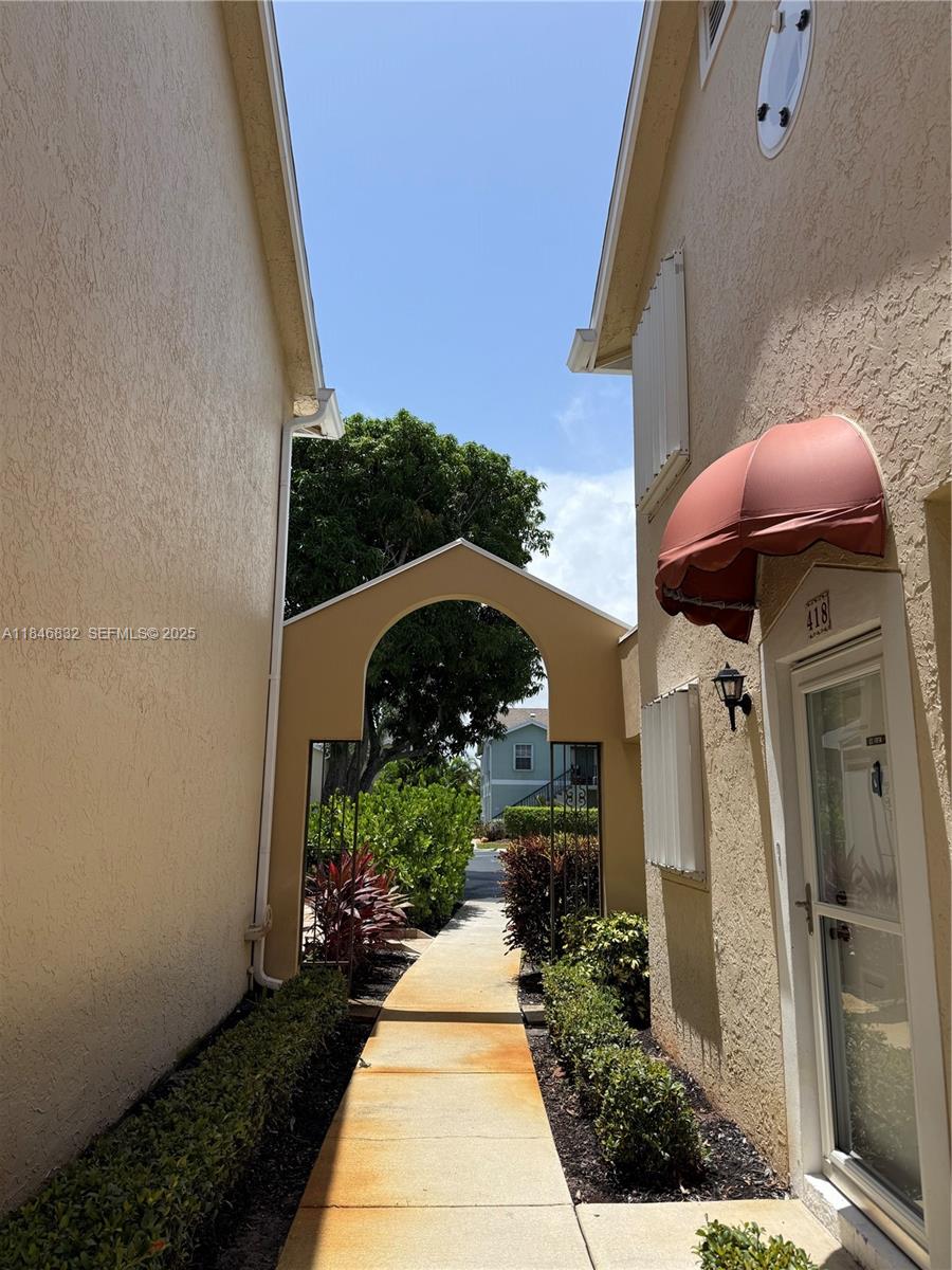 417 Waterside Drive Hypoluxo, FL 33462 - Photo 50 of 52 a front view of a house with a yard