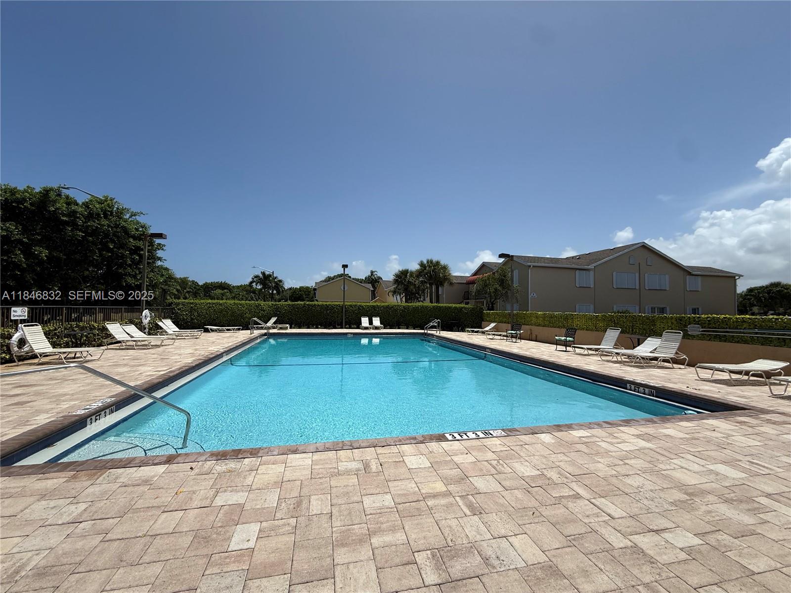 417 Waterside Drive Hypoluxo, FL 33462 - Photo 51 of 52 a view of swimming pool with lounge chair