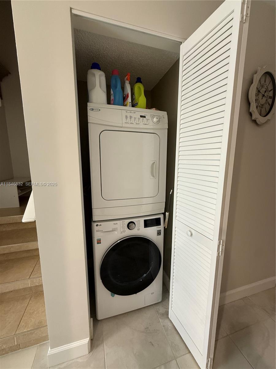 417 Waterside Drive Hypoluxo, FL 33462 - Photo 10 of 52 a utility room with dryer and washer