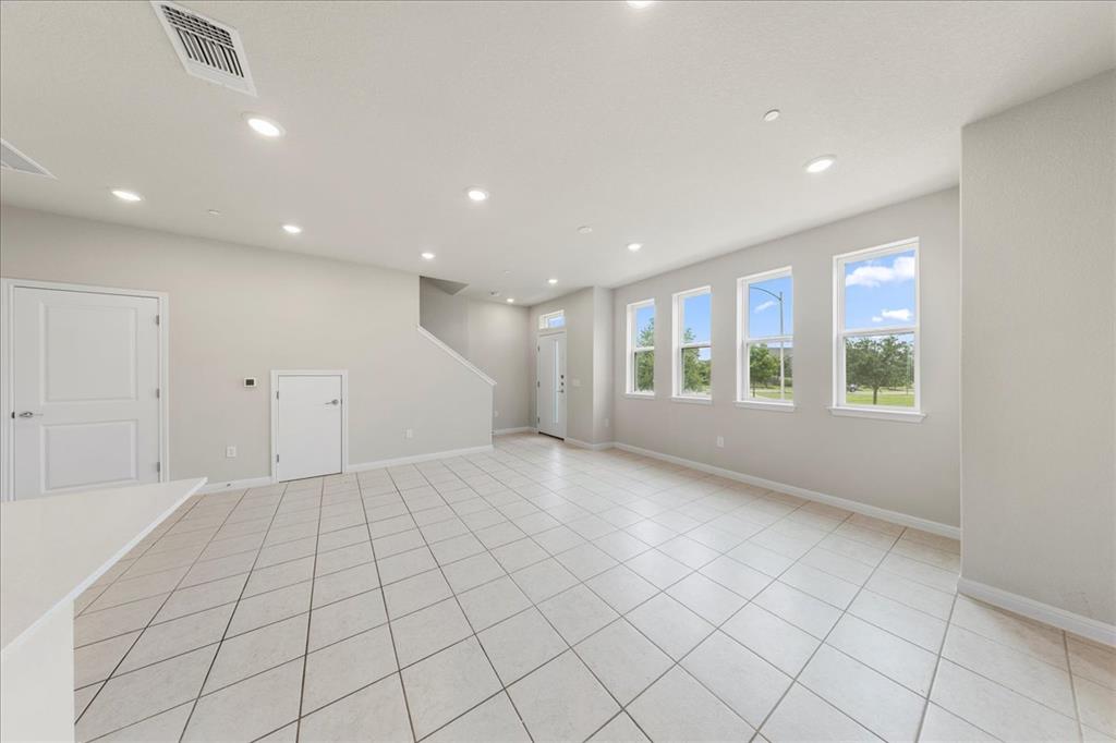 9015 Cattle Baron Path, Unit 1502 Austin, TX 78747 - Photo 23 of 32 Unfurnished room featuring recessed lighting and light tile patterned flooring