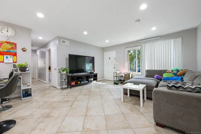 a view of kitchen with dining area and stainless steel appliances