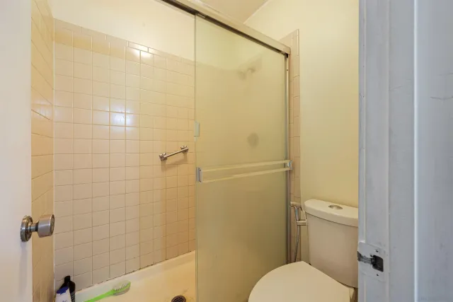 a bathroom with a sink vanity mirror and toilet