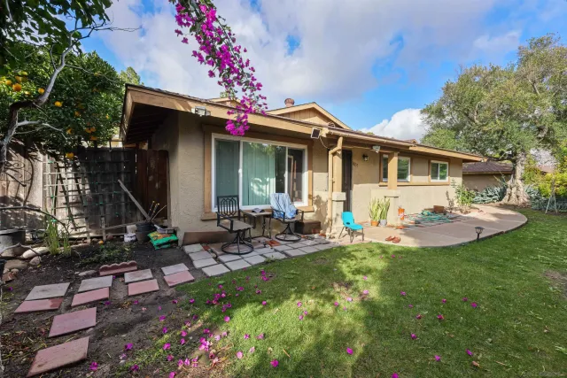 a front view of house with an outdoor seating