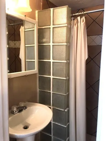 a bathroom with a sink and a mirror
