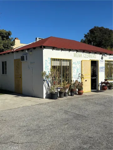 a view of a house with porch and furniture