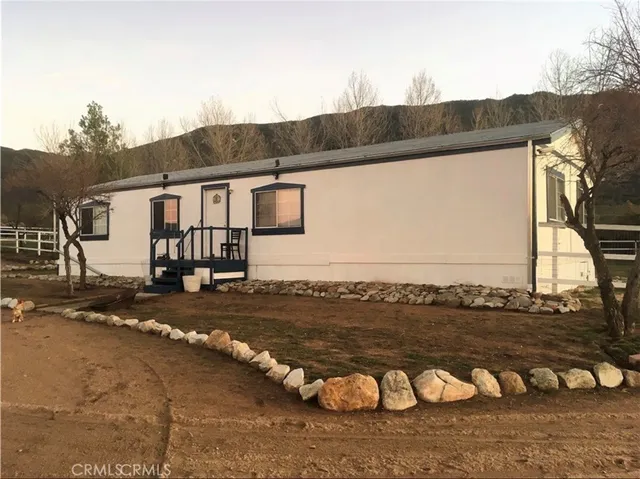 a view of a back yard of the house
