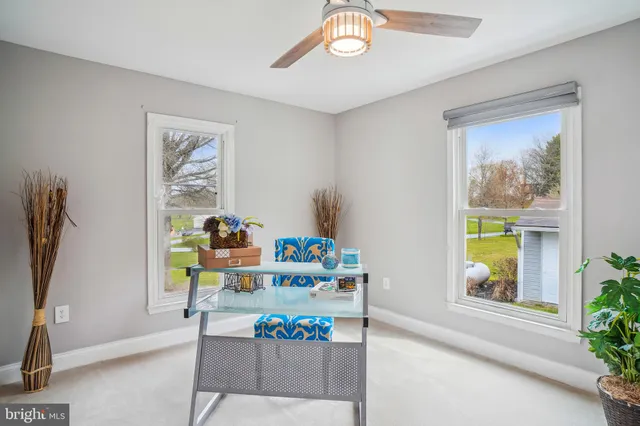 a workspace with furniture and window