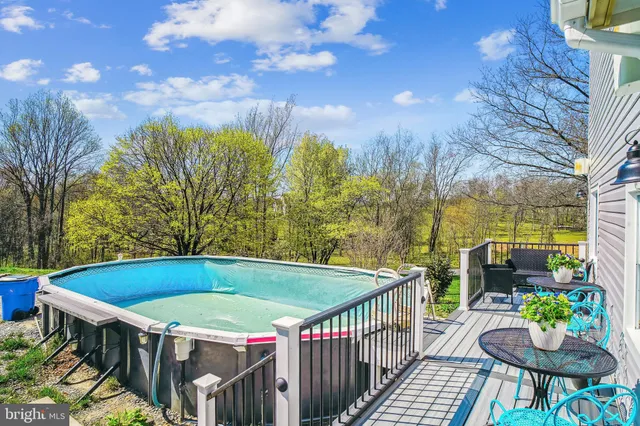 a view of a patio with swimming pool