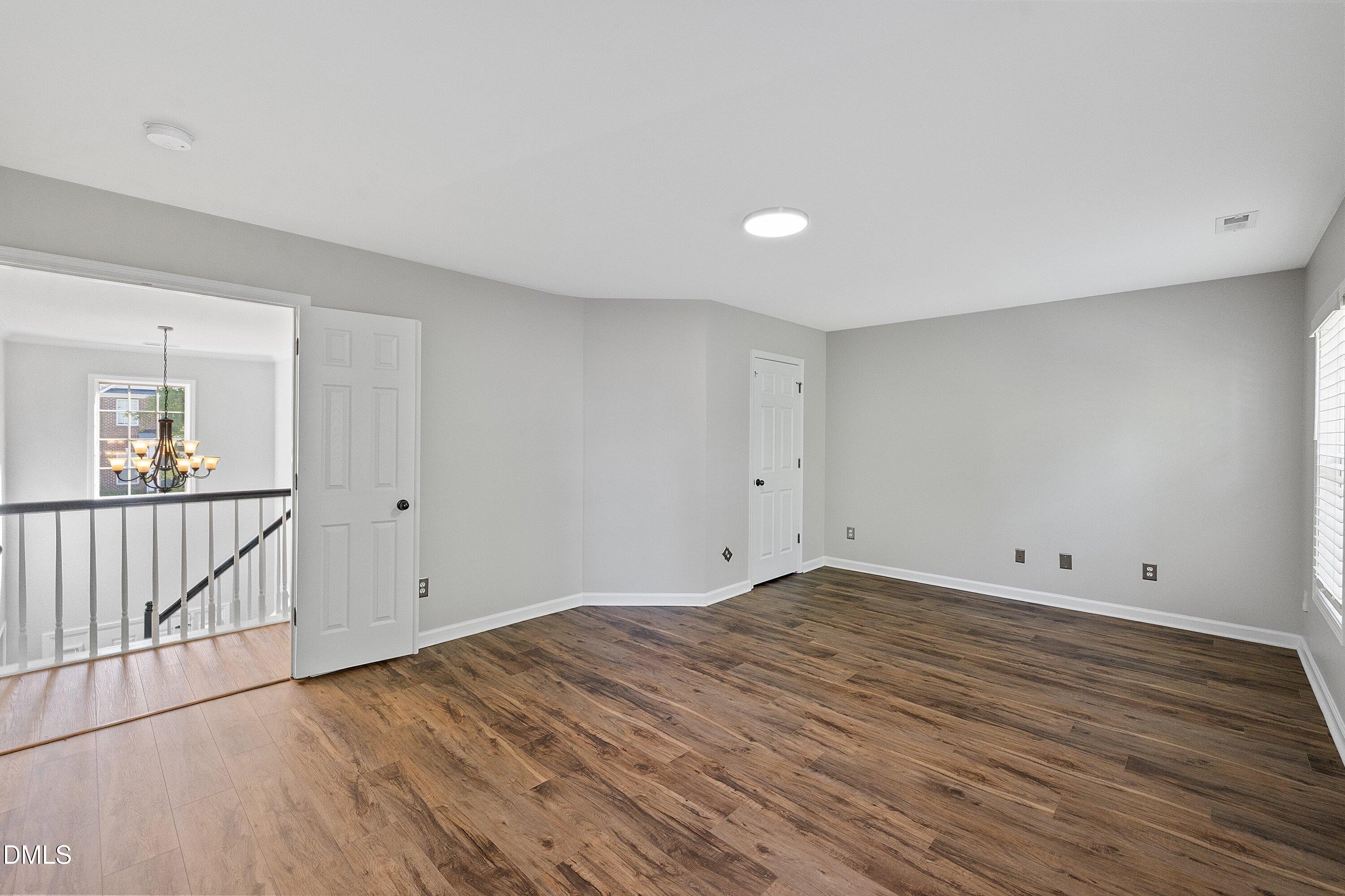 3717 Windmeade Road Wake Forest, NC 27587 - Photo 39 of 51 a view of room with wooden floor