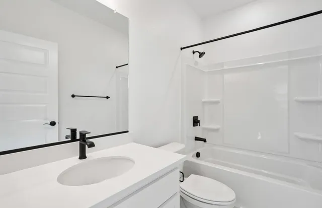 a bathroom with a shower and a bathtub