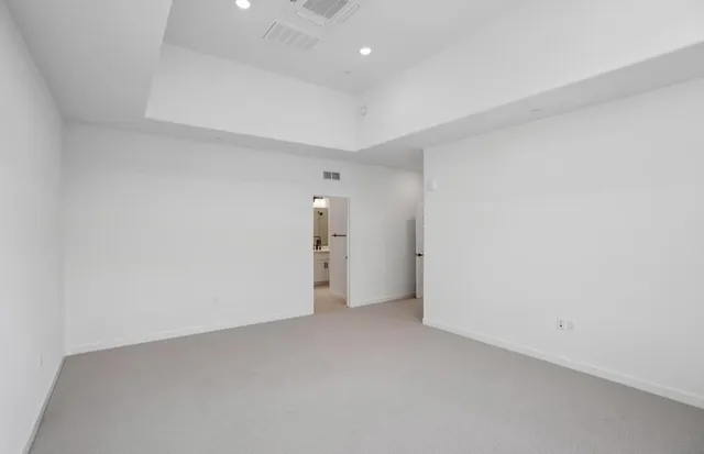 a bathroom with a sink vanity granite shower and a mirror