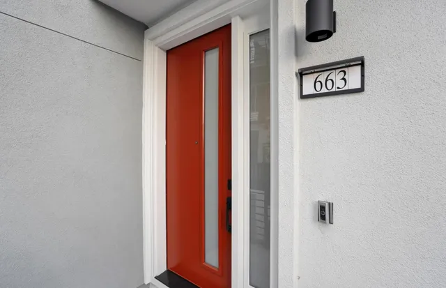 a view of a hallway with front door