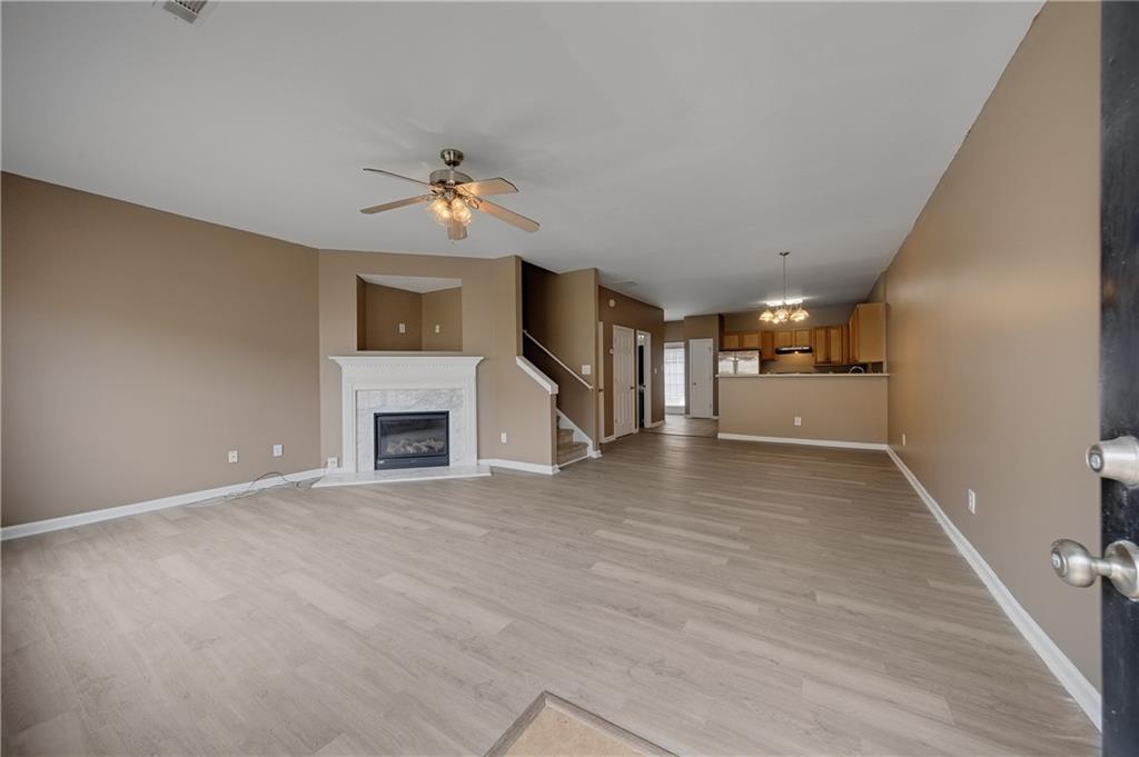 4203 Legacy Square Atlanta, GA 30349 - Photo 7 of 35 wooden floor fireplace and windows in an empty room