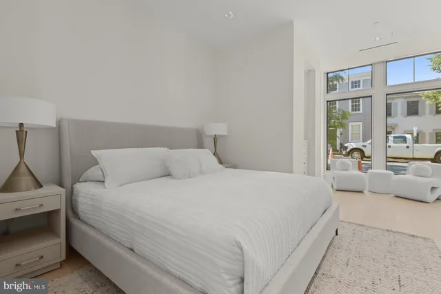 a large white bed in a white room