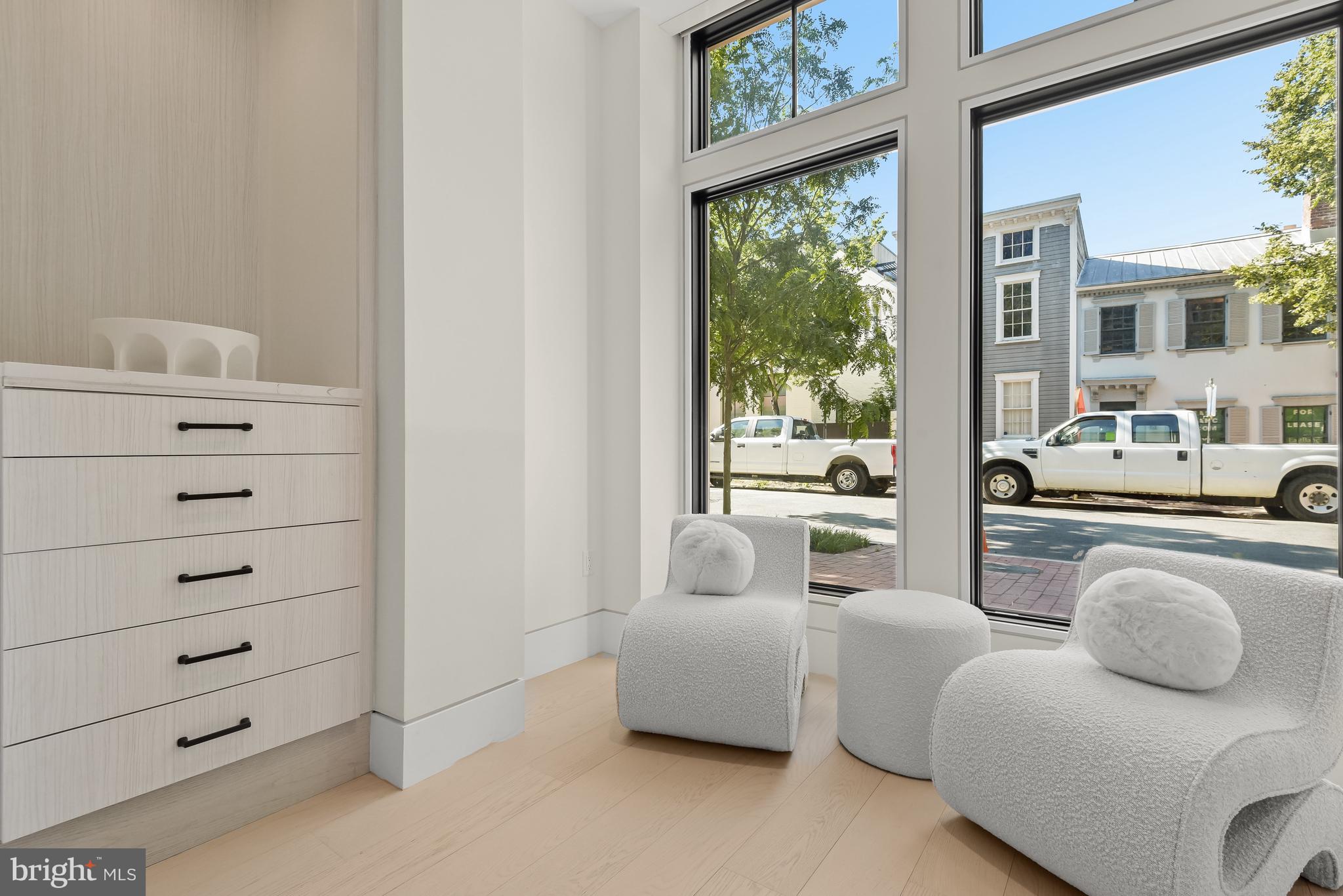 3255 Prospect Street Northwest, Unit ONE Washington, DC 20007 - Photo 13 of 18 a living room with furniture and a floor to ceiling window